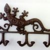 Porte manteau salamandre en fonte ajourée